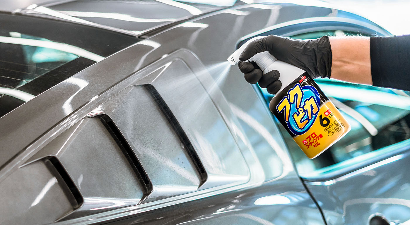 Soft99 car care product Fukupika Spray being used on a car.